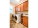 Spacious laundry room with lots of storage and stainless washer and dryer at 160 Edgewater Trl, Fayetteville, GA 30215