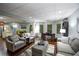 Open concept living room and dining area with hardwood floors and recessed lighting at 160 Edgewater Trl, Fayetteville, GA 30215