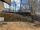 Backyard features a wooden deck, terraced steps, and retaining walls at 4312 Defoors Farm Trl, Powder Springs, GA 30127