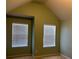 Vaulted bedroom with neutral walls and natural light from two windows at 4312 Defoors Farm Trl, Powder Springs, GA 30127