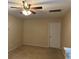 Bedroom featuring tan carpet and a lighted ceiling fan at 4312 Defoors Farm Trl, Powder Springs, GA 30127