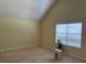 Bedroom with a vaulted ceiling, window with blinds, and neutral walls at 4312 Defoors Farm Trl, Powder Springs, GA 30127