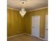 Bedroom with plush carpet, chandelier, and white trim at 4312 Defoors Farm Trl, Powder Springs, GA 30127