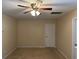 Bedroom featuring tan carpet and a lighted ceiling fan at 4312 Defoors Farm Trl, Powder Springs, GA 30127