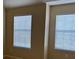 Sunlight streams into the bedroom through the many horizontal blinds at 4312 Defoors Farm Trl, Powder Springs, GA 30127