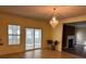 Dining area featuring a chandelier, sliding glass doors, and fireplace at 4312 Defoors Farm Trl, Powder Springs, GA 30127