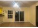 Elegant dining room with chandelier and sliding glass door at 4312 Defoors Farm Trl, Powder Springs, GA 30127