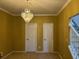 Hallway with plush carpet, chandelier, and white trim at 4312 Defoors Farm Trl, Powder Springs, GA 30127