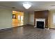 Bright living room features a fireplace and wood flooring at 4312 Defoors Farm Trl, Powder Springs, GA 30127