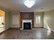 Bright living room features a fireplace and wood flooring at 4312 Defoors Farm Trl, Powder Springs, GA 30127