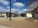 Street view with well-maintained lawns and houses under a cloudy sky at 4312 Defoors Farm Trl, Powder Springs, GA 30127