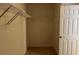 Empty walk-in closet with standard shelving and neutral walls at 4312 Defoors Farm Trl, Powder Springs, GA 30127