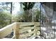 A newly constructed back porch shows off a wooden fence and a full screen door to enjoy the outdoors at 455 Dollar Mill Sw Rd, Atlanta, GA 30331