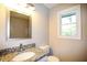 Bathroom featuring granite countertops and a framed mirror at 455 Dollar Mill Sw Rd, Atlanta, GA 30331