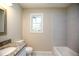 Neutral colored bathroom featuring granite countertops and tiled shower and tub at 455 Dollar Mill Sw Rd, Atlanta, GA 30331