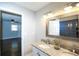 Bathroom featuring double sinks, granite countertops, and an adjoining bedroom at 455 Dollar Mill Sw Rd, Atlanta, GA 30331