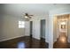 A view of a bedroom featuring hardwood floors, two closets, and a ceiling fan at 455 Dollar Mill Sw Rd, Atlanta, GA 30331