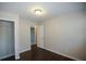 A neutral colored bedroom with hardwood floors and closet at 455 Dollar Mill Sw Rd, Atlanta, GA 30331