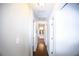 Bright hallway leading to various rooms with neutral walls and hardwood floors at 455 Dollar Mill Sw Rd, Atlanta, GA 30331