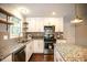 Recently renovated kitchen with granite countertops, stainless steel appliances, and lots of storage at 455 Dollar Mill Sw Rd, Atlanta, GA 30331