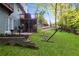 Serene backyard featuring a hammock, patio, and lush greenery at 1421 Eryn Cir, Suwanee, GA 30024