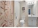 Cozy bathroom with neutral tones, decorative shower curtain, and a vanity with ample storage space at 1421 Eryn Cir, Suwanee, GA 30024