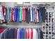 This organized walk-in closet features hanging racks and shelving for ample storage at 1421 Eryn Cir, Suwanee, GA 30024