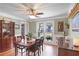 This dining room offers a wooden table, large window, and plenty of space for entertaining at 1421 Eryn Cir, Suwanee, GA 30024