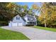 Beautiful two-story home with two-car garage, long driveway, and surrounded by lush greenery at 1421 Eryn Cir, Suwanee, GA 30024