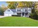 Charming two-story home with a well-manicured lawn, two-car garage, and welcoming front porch at 1421 Eryn Cir, Suwanee, GA 30024