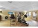 Home gym with exercise equipment and access to the back patio at 1421 Eryn Cir, Suwanee, GA 30024