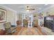 Inviting living room with hardwood floors, stone fireplace, and French doors at 1421 Eryn Cir, Suwanee, GA 30024