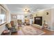 Bright living room with fireplace, hardwood floors, and neutral decor at 1421 Eryn Cir, Suwanee, GA 30024