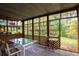 Enclosed patio with lattice and large windows bringing the outside in at 1421 Eryn Cir, Suwanee, GA 30024