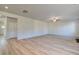 Bright, open living room featuring wood floors, a ceiling fan, and neutral paint at 108 Dalston Cv, Stockbridge, GA 30281