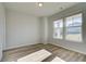 Bright room with luxury vinyl plank flooring, two large windows, and neutral walls, perfect for a home office at 108 Dalston Cv, Stockbridge, GA 30281