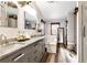 Bathroom featuring double sinks, ample counter space, and a large tub for relaxation at 1370 A Cronic Town Rd, Auburn, GA 30011