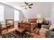 This is a cozy bedroom with a wooden sleigh bed and a ceiling fan at 1370 A Cronic Town Rd, Auburn, GA 30011