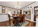 View of the dining room which opens to a large living room and kitchen at 1370 A Cronic Town Rd, Auburn, GA 30011