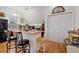 Kitchen featuring bar seating, wood floors, and a large pantry for ample storage space at 1370 A Cronic Town Rd, Auburn, GA 30011