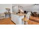 Bright and airy kitchen featuring an island with seating and open-concept living space at 1370 A Cronic Town Rd, Auburn, GA 30011