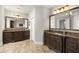 Spacious bathroom featuring double vanities, granite countertops, and ample storage space at 5650 Copper Creek Pass, Cumming, GA 30040