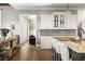 Elegant kitchen open to the living room features a granite island with barstool seating at 5650 Copper Creek Pass, Cumming, GA 30040