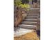 Stone steps between large boulders leading to backyard at 5650 Copper Creek Pass, Cumming, GA 30040