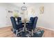 Cozy dining area featuring a glass table and four velvet chairs at 1901 Lullwater Cir, Jonesboro, GA 30236