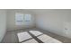 Bedroom with natural light shining on the neutral carpet through the windows at 208 Chiswick Loop, Stockbridge, GA 30281