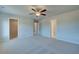 Large bedroom with walk-in closet, carpet, and neutral paint at 208 Chiswick Loop, Stockbridge, GA 30281