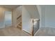 Hallway with carpet and stairs leading to the second floor at 208 Chiswick Loop, Stockbridge, GA 30281