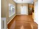 Bright dining area features hardwood floors, a modern light fixture, and natural light from a large window at 2470 Arnold Mill Rd, Lawrenceville, GA 30044