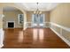 Dining room with hardwood floors, chandelier, and natural light at 2470 Arnold Mill Rd, Lawrenceville, GA 30044